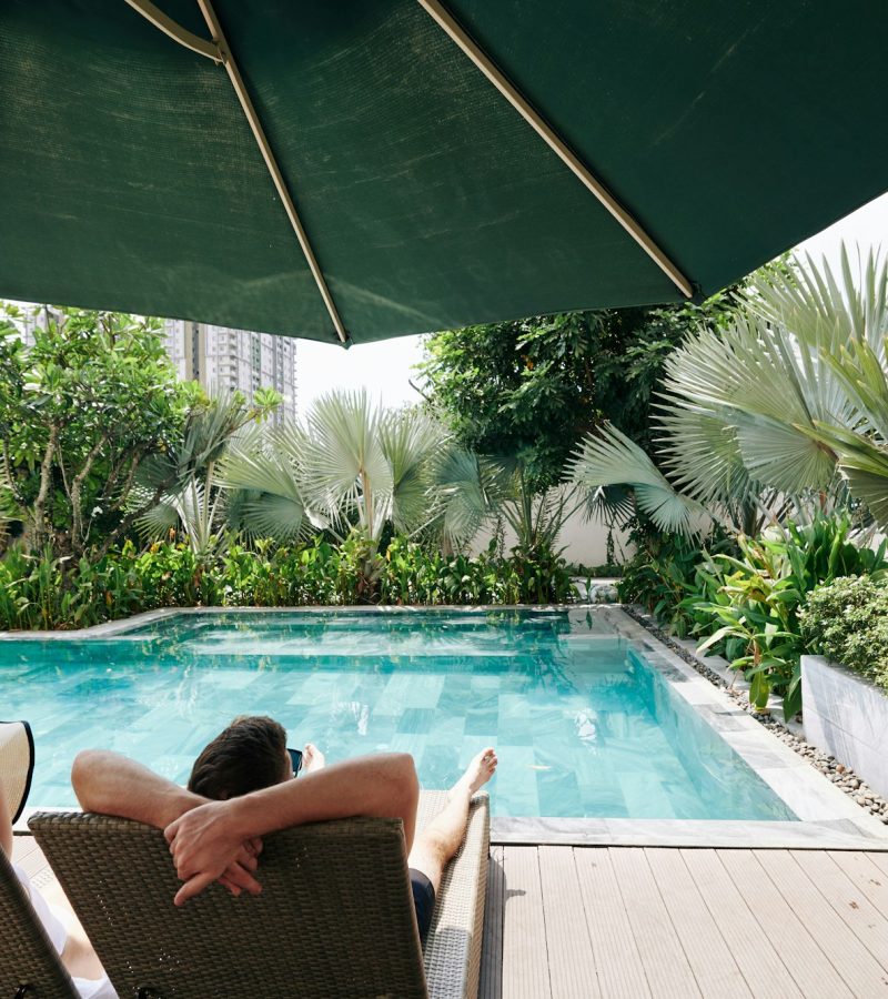 Couple pending time by secluded swimming pool